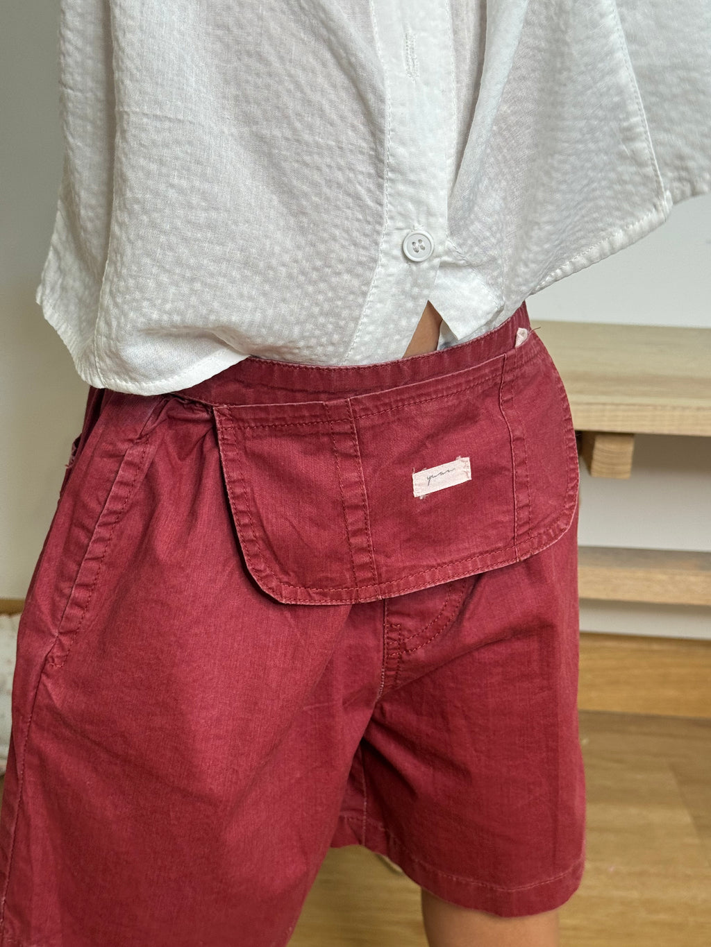 Shorts con tasca utility
